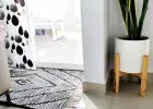 Green plant on white ceramic pot